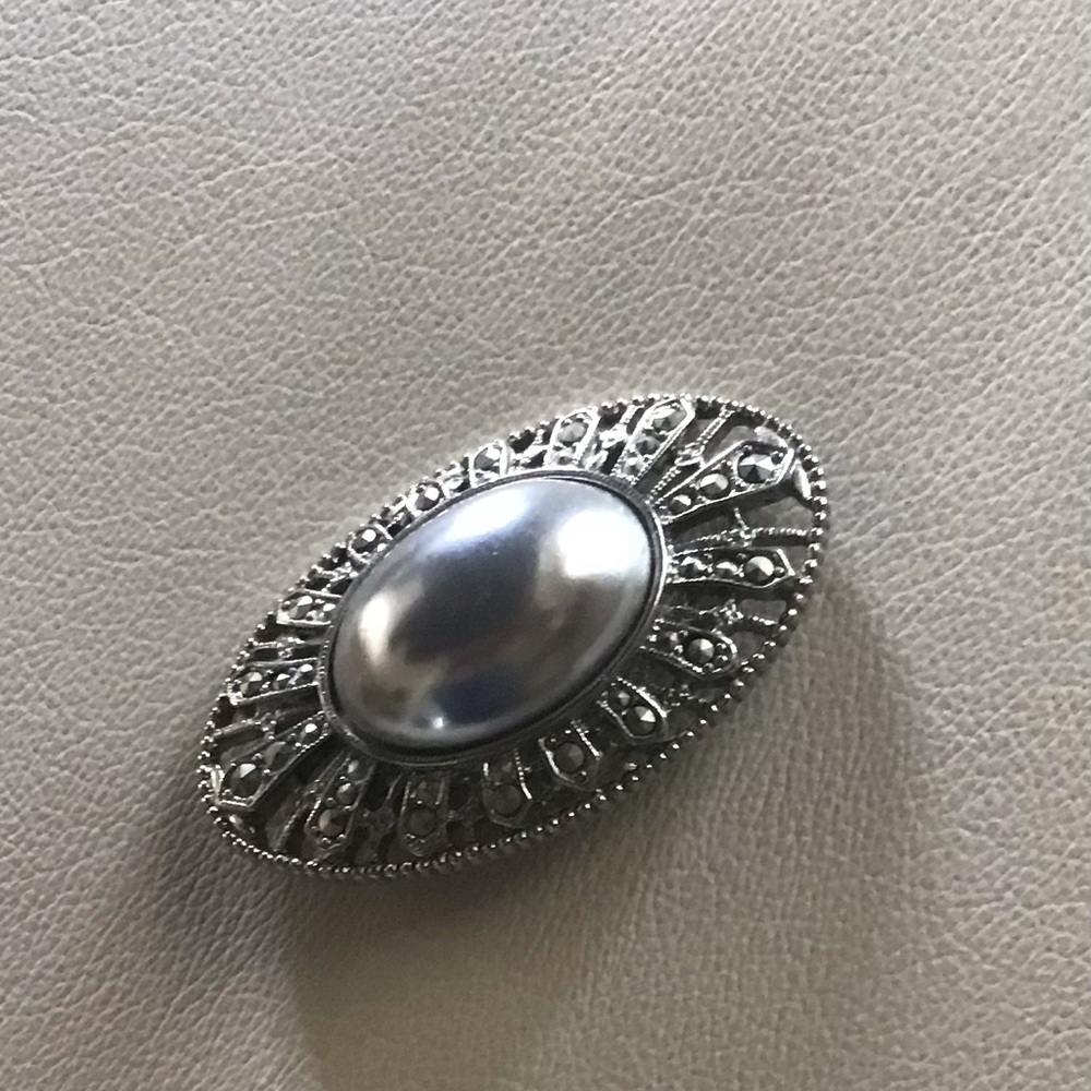 Beautiful silver brooch filigree, crystal and silver pearl-like center